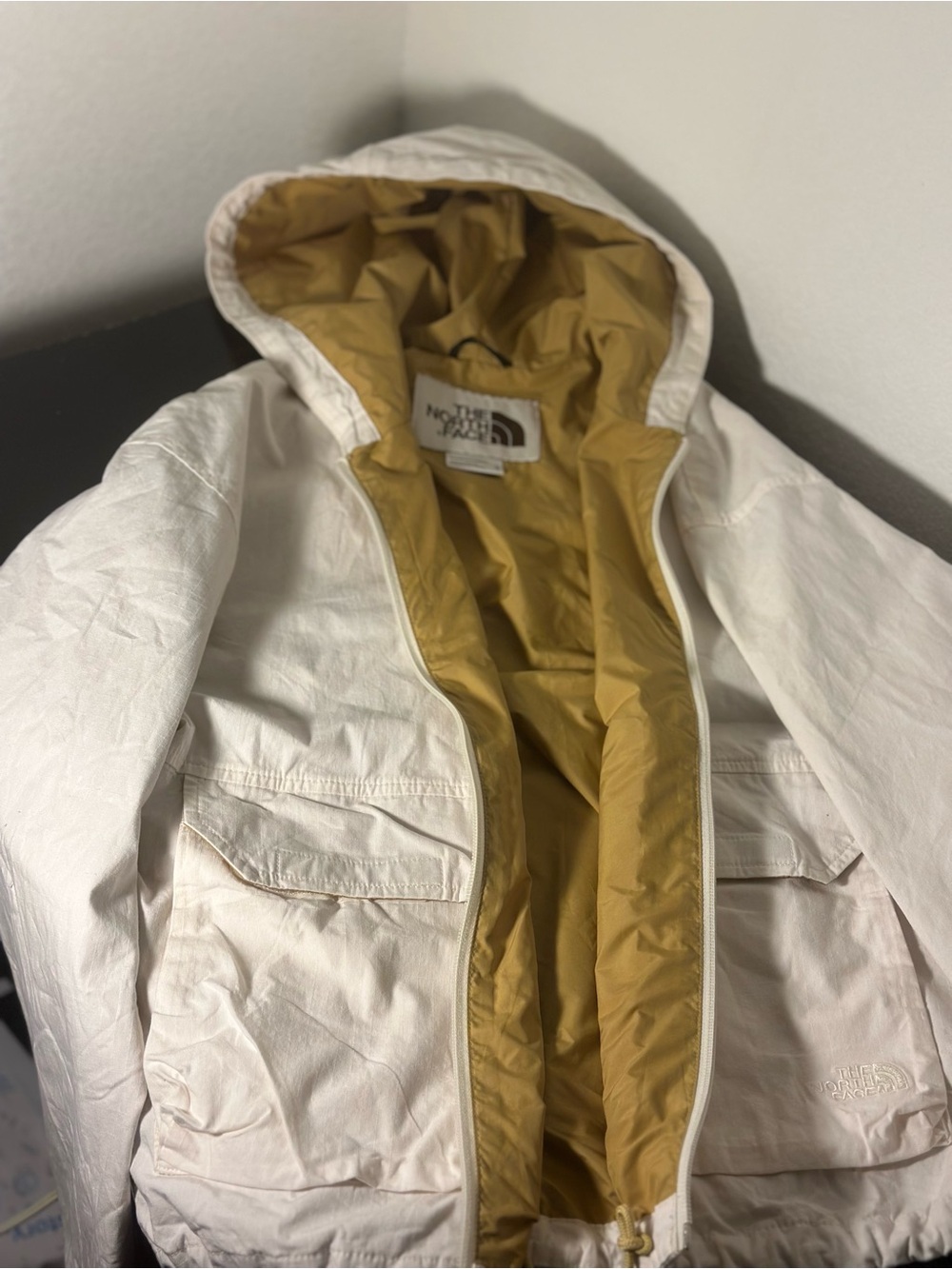 The North Face Woman’s Hooded Jacket in White with Mustard Lining
